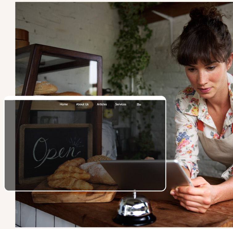 young female business owner in her store on a tablet device who needs affordable website design packages